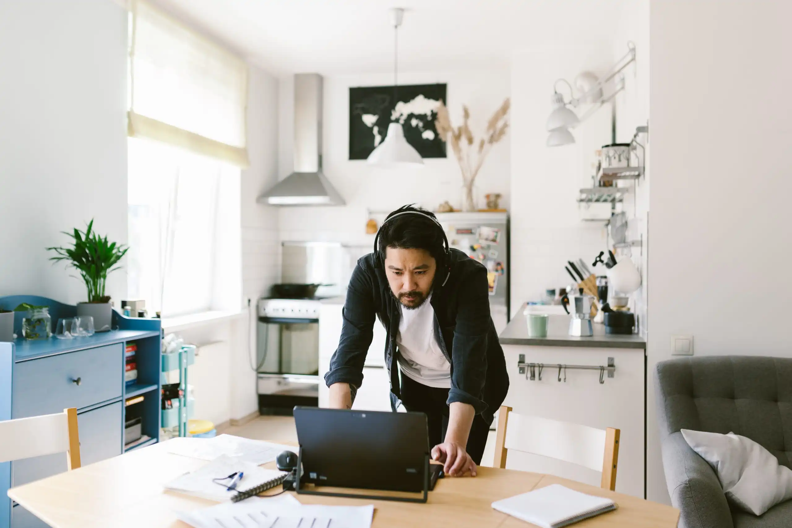 Asian man looks at the computer during video conference call